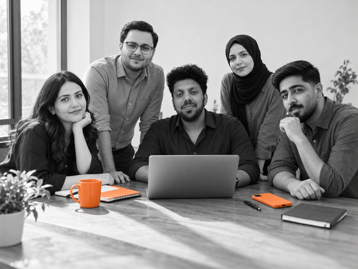 The Offshore Employee team working together around a table